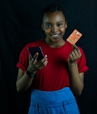 A young woman holding a mastercard